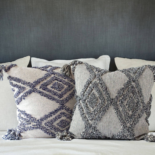  tufted pillow cover with diamond pattern and tassel detail.
